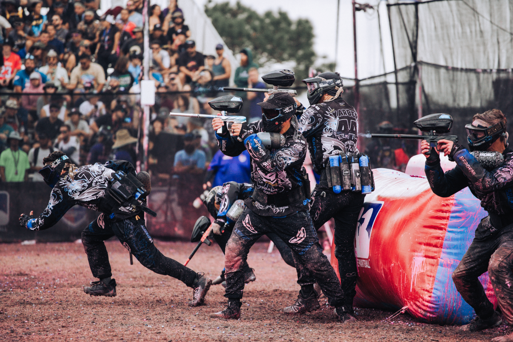 NXL paintball players in action on the field